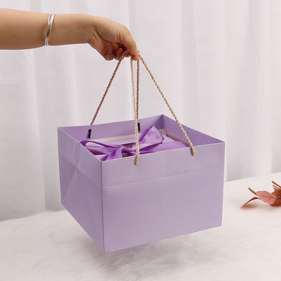 Red Art Paper Kraft Gift Box With Window Rope Handle For Perfume Packaging